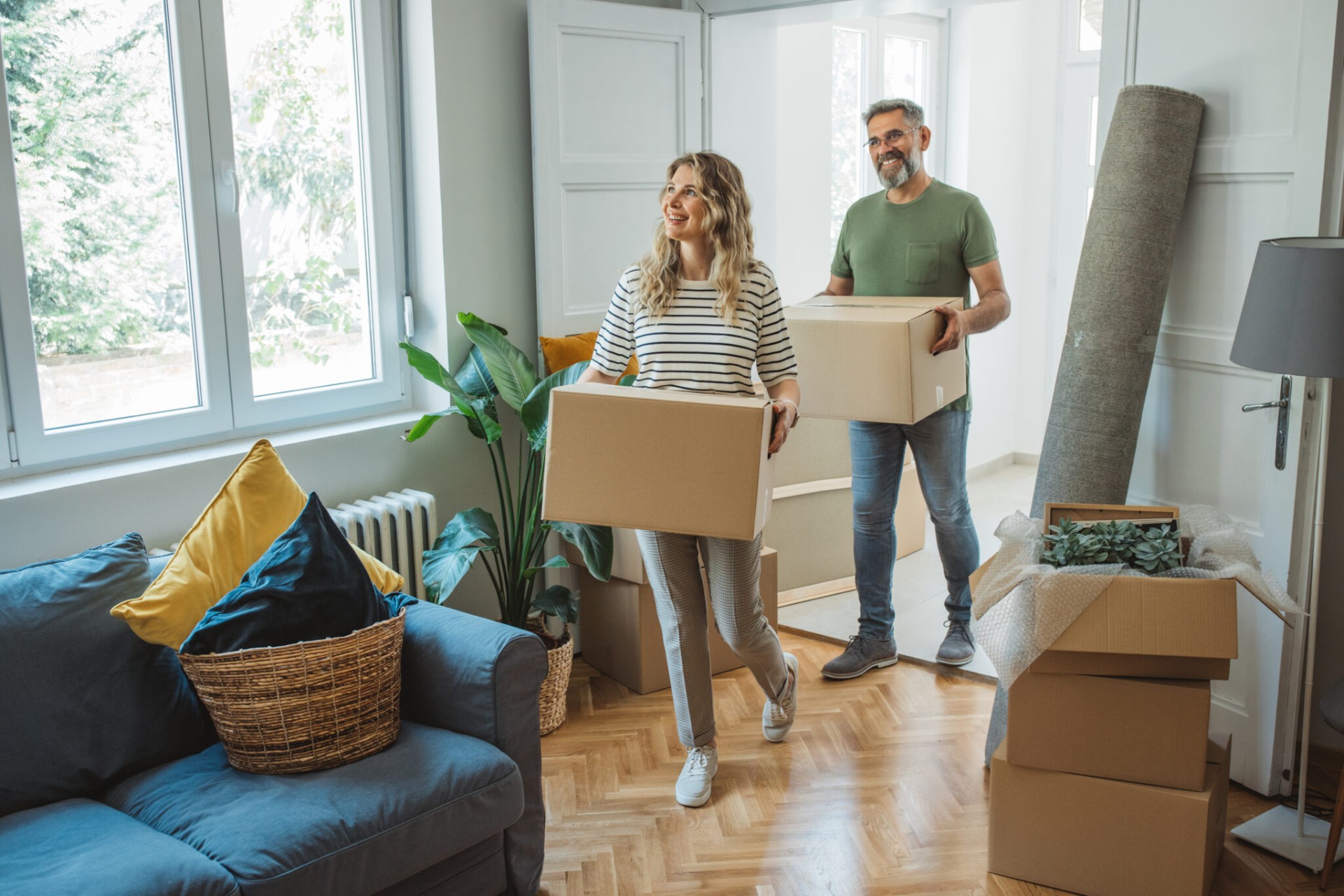Happy couple moving into their new home